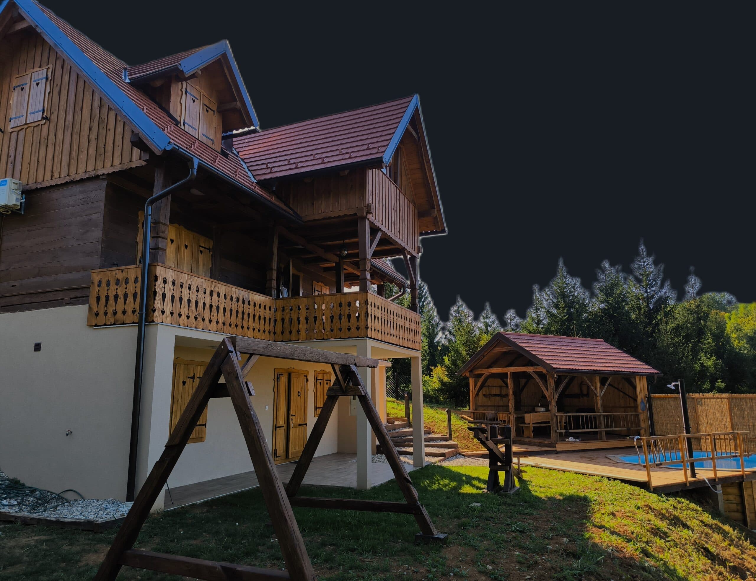 The house and gazebo at dusk with the pool in the foreground