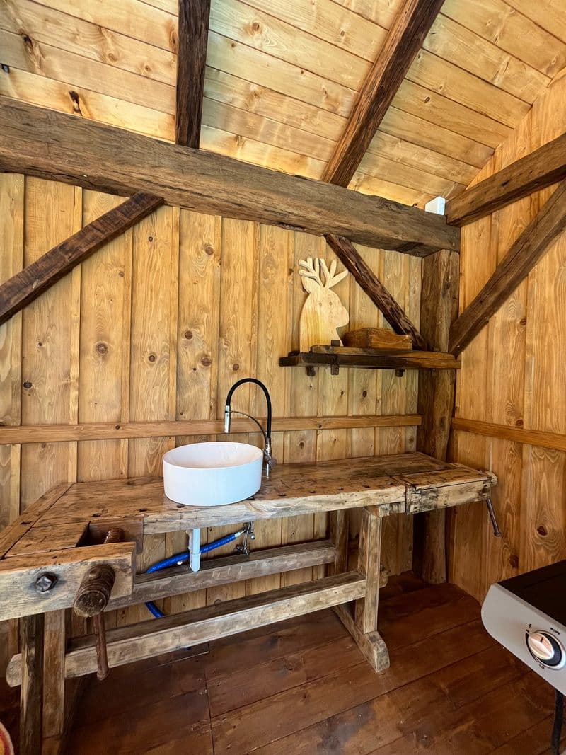 Outdoor kitchen prep station built from a reclaimed carpenter's workbench